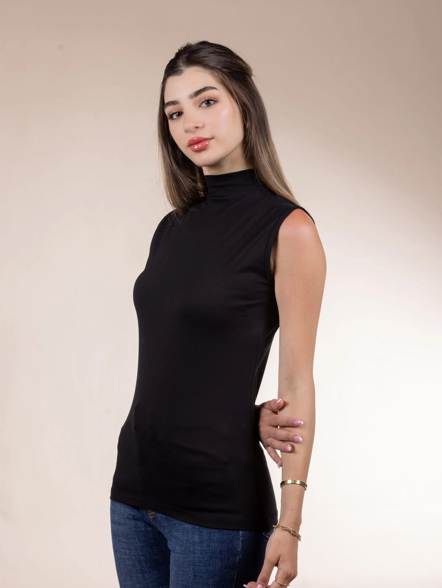 A sleeveless cotton bodysuit with a half-neck.