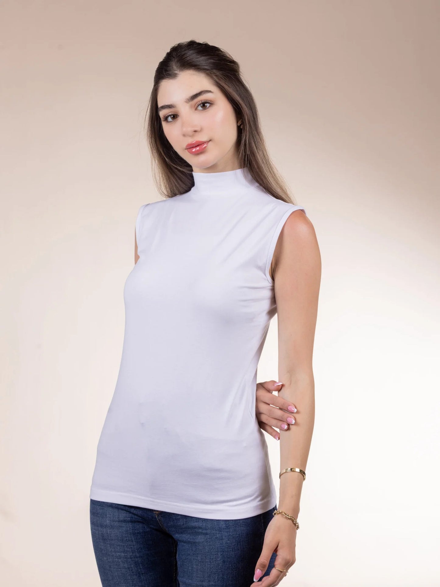 A sleeveless cotton bodysuit with a half-neck.